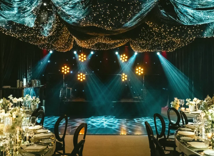 Lighting rig above a presenter set